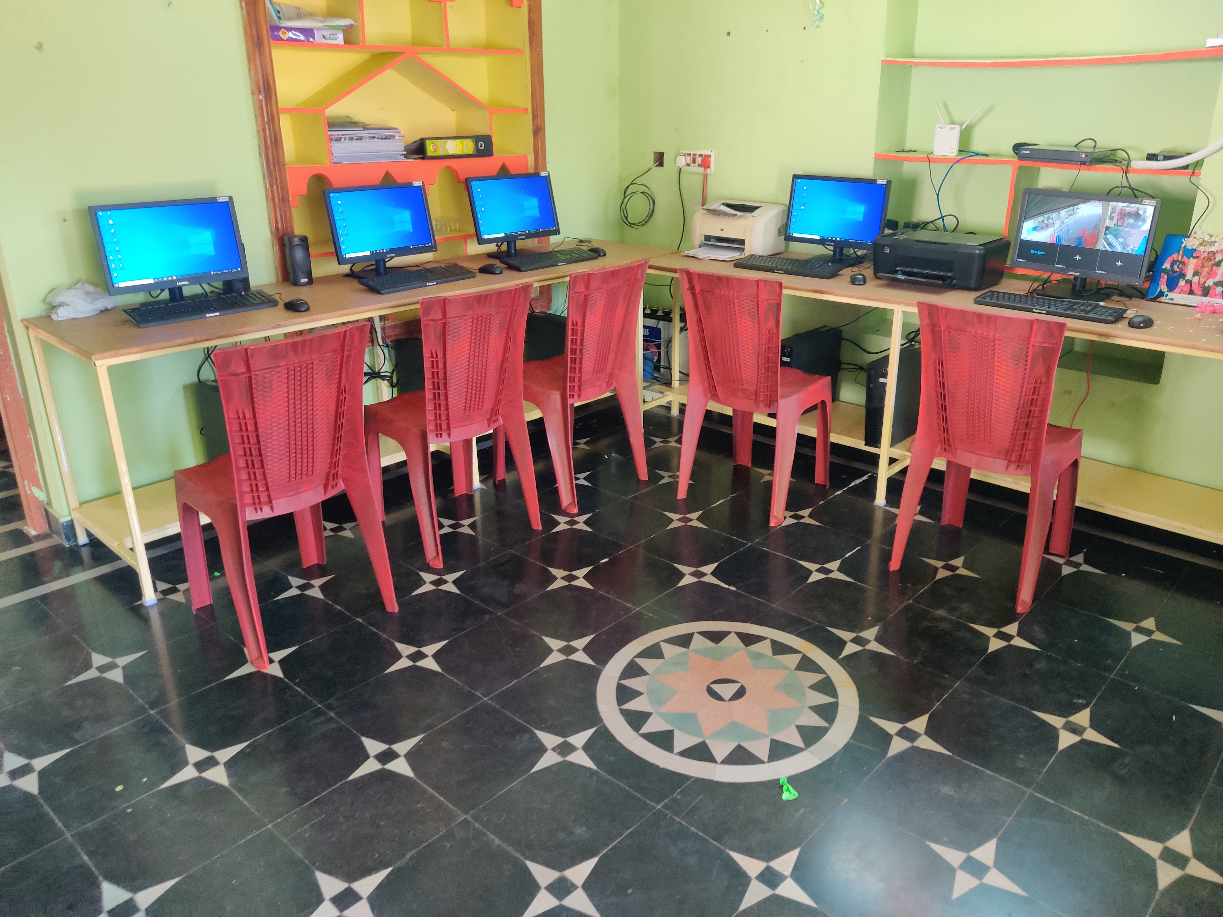 Computer training room set up with desks and monitors ahead of a session
